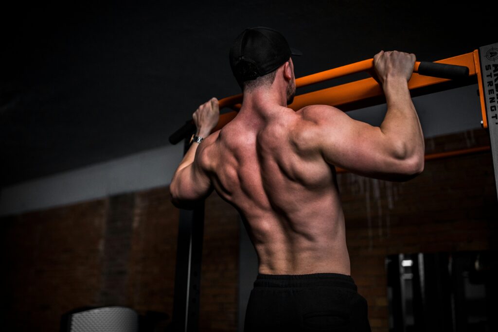 strong man doing pull-ups showing physical fitness and masculine confidence building