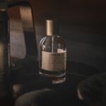 Le Labo Santal 33 perfume bottle - popular woody niche fragrance for confident young man in 2025