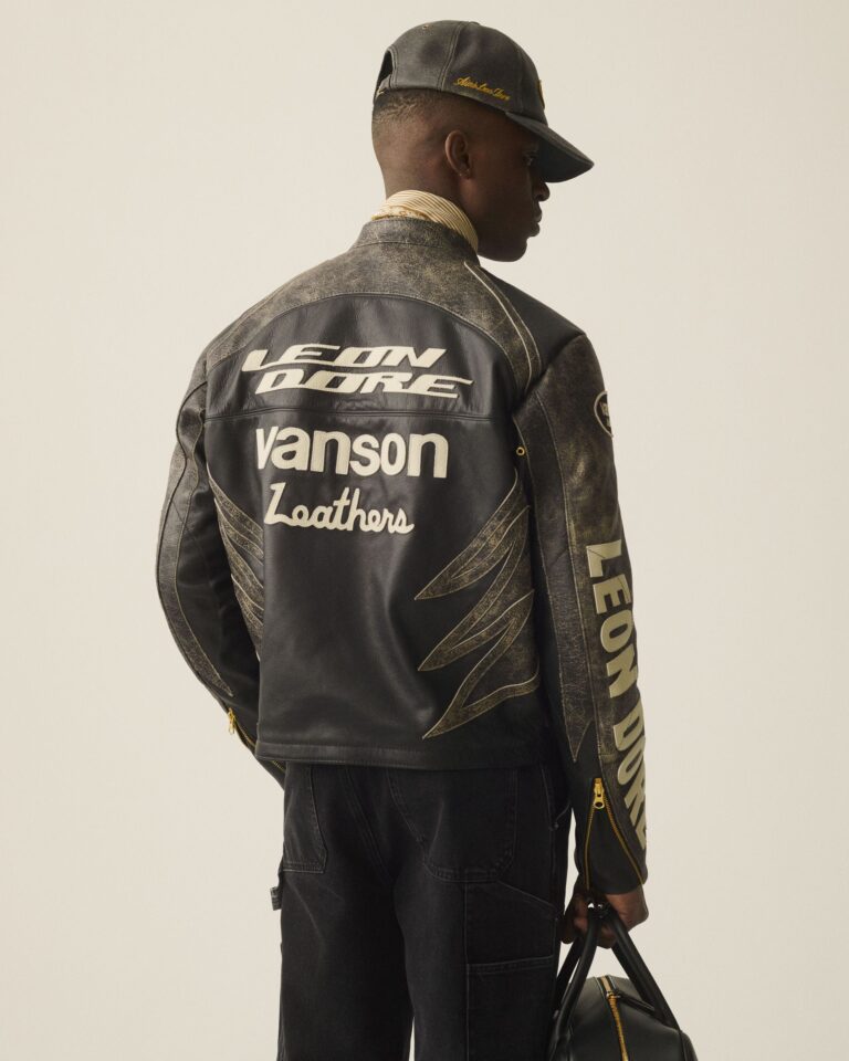 african man wearing a very high quality leather jacket from aime leon dore