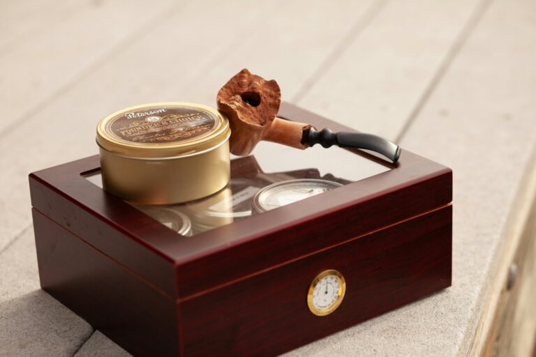 cigar pipe on top of a humidor
